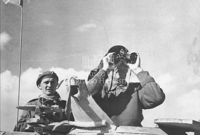 "The Eight Army Commander watching the battle from the turret of the Grant tank in wich he travelled in the forward areas"