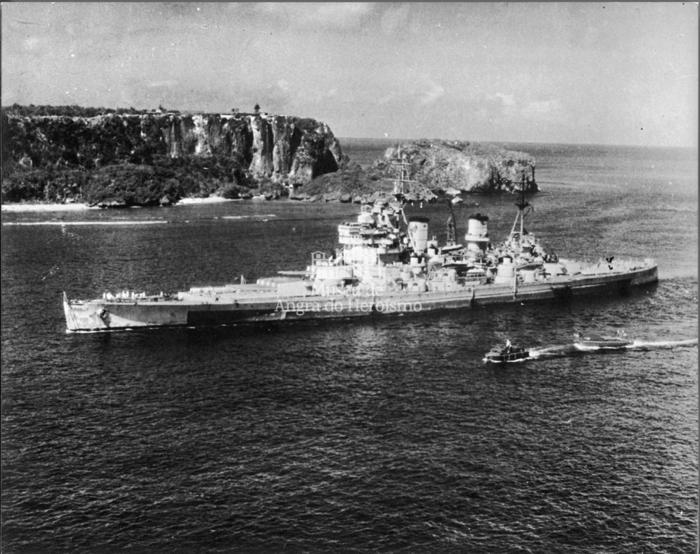"<i>King George V</i> enters harbour at Guam"